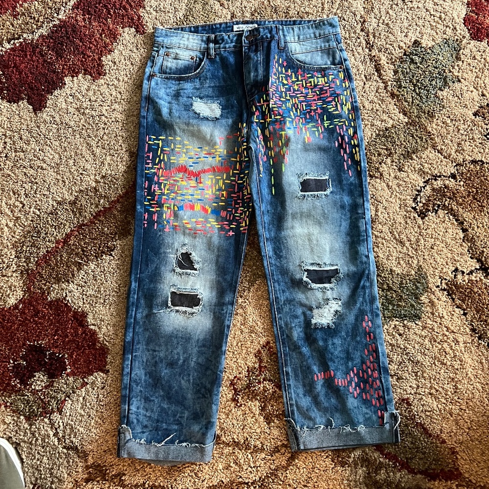 Distressed painted jeans.